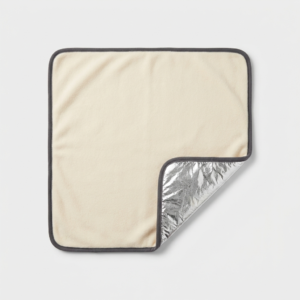 Self-warming pet mat with reflective thermal layer and cream fleece top